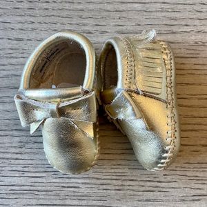 Gold Minnetonka Moccasins with Bow 1c